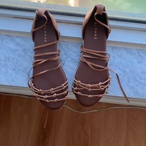 Alohas size 38 EUR size, brown leather, ties around ankle.